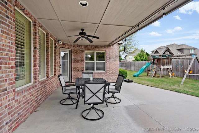 12643 S 67th E Ave, Bixby, OK 74070 - view of patio featuring a playground, outdoor dining area, and ceiling fan