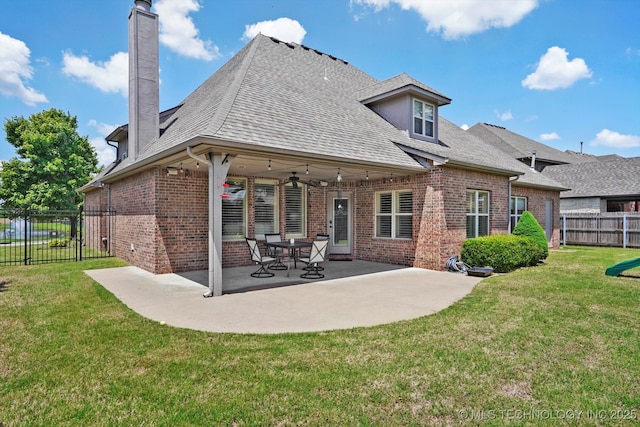 12643 S 67th E Ave, Bixby, OK 74070 - back of property with brick siding, a patio, a chimney, a shingled roof, and a ceiling fan