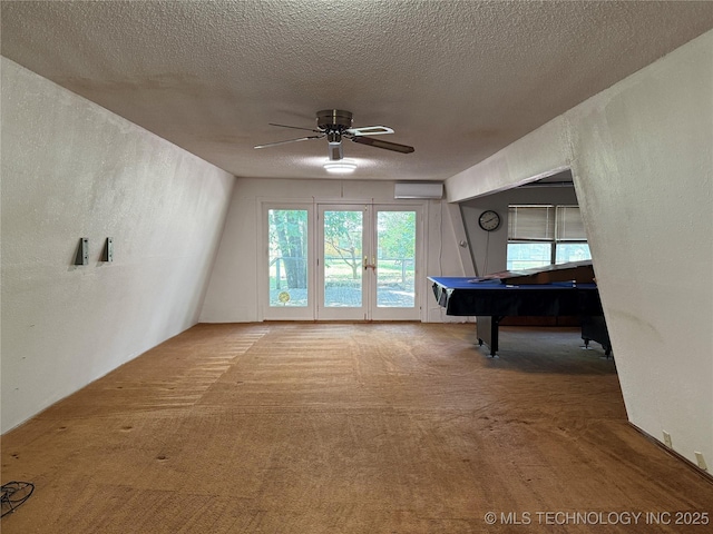 2099 S 80th St E, Muskogee, OK 74403 - game room featuring carpet flooring, a wall mounted air conditioner, pool table, ceiling fan, and a textured ceiling