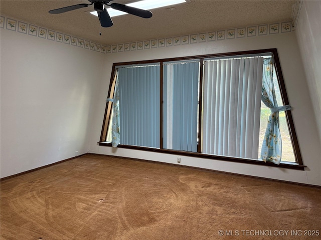 2099 S 80th St E, Muskogee, OK 74403 - unfurnished room with carpet flooring, ceiling fan, and baseboards