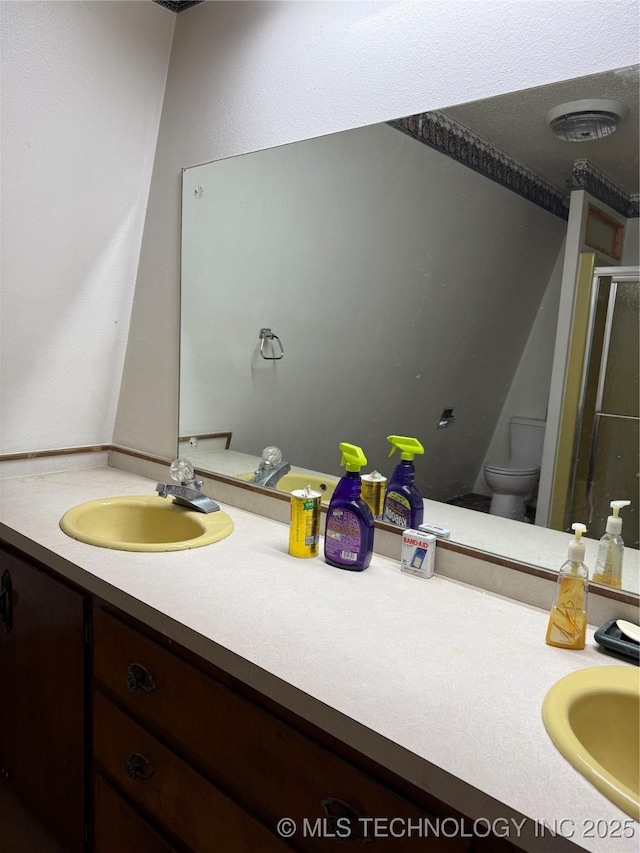 2099 S 80th St E, Muskogee, OK 74403 - bathroom with vanity, toilet, and a shower stall