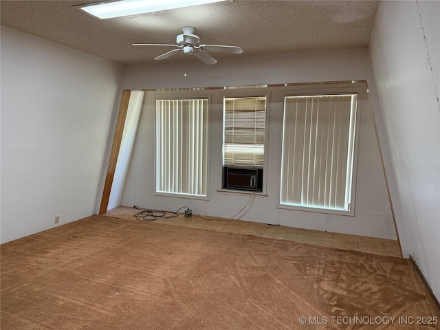 2099 S 80th St E, Muskogee, OK 74403 - unfurnished room with carpet, a ceiling fan, cooling unit, and a textured ceiling
