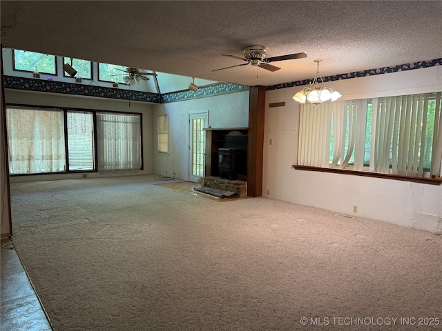 2099 S 80th St E, Muskogee, OK 74403 - unfurnished living room with carpet, a ceiling fan, plenty of natural light, and a textured ceiling