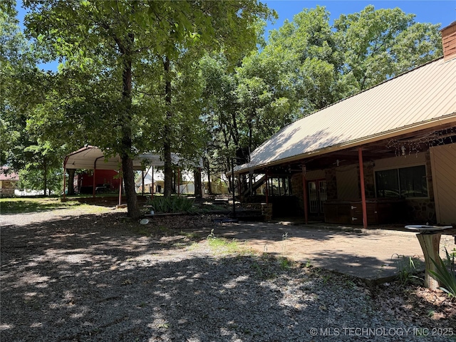 2099 S 80th St E, Muskogee, OK 74403 - view of yard featuring a patio and a detached carport