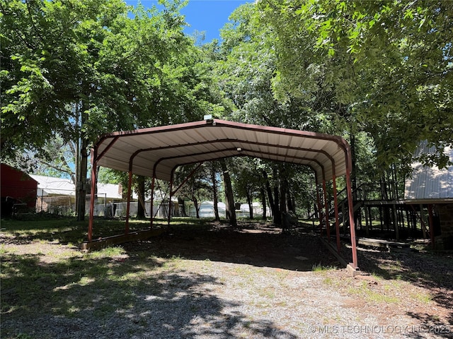 2099 S 80th St E, Muskogee, OK 74403 - view of community featuring gravel driveway and a detached carport