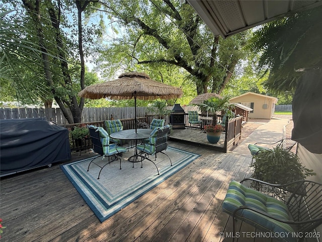 1732 N Little, Cushing, OK 74023 - deck featuring outdoor dining area, a fenced backyard, and a grill