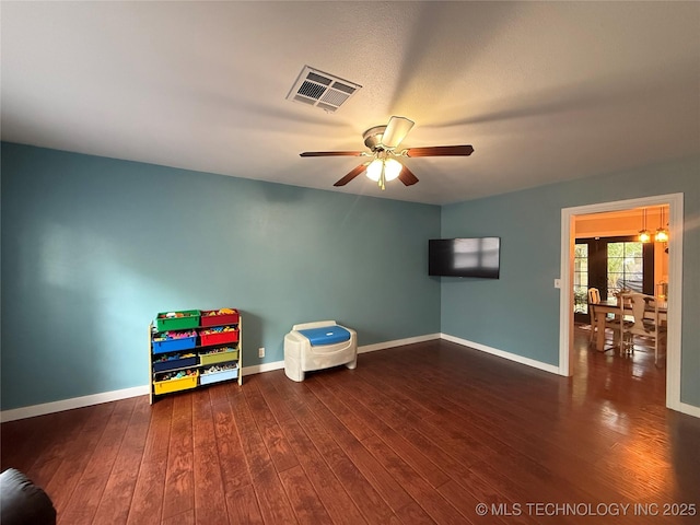 1732 N Little, Cushing, OK 74023 - game room with wood finished floors, ceiling fan, and baseboards