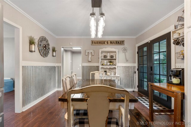 1732 N Little, Cushing, OK 74023 - dining area featuring dark wood-type flooring, crown molding, french doors, and a chandelier