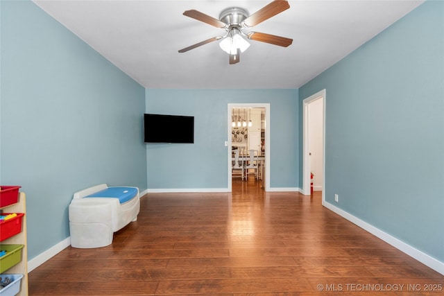 1732 N Little, Cushing, OK 74023 - spare room featuring wood-type flooring and ceiling fan