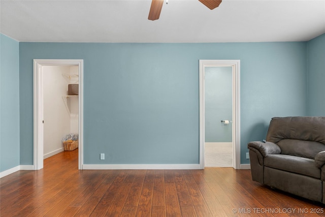 1732 N Little, Cushing, OK 74023 - sitting room featuring dark wood-style floors and a ceiling fan