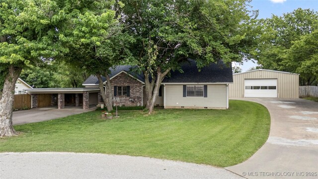 1732 N Little, Cushing, OK 74023 - view of front of house featuring concrete driveway, an outbuilding, a garage, roof with shingles, and crawl space