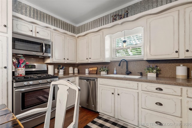 1732 N Little, Cushing, OK 74023 - kitchen with stainless steel appliances, tasteful backsplash, crown molding, and dark wood-style flooring