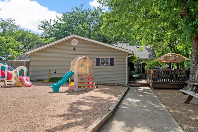 1732 N Little, Cushing, OK 74023 - view of front of home with a playground and a wooden deck