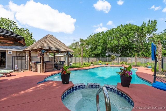 1732 N Little, Cushing, OK 74023 - view of pool with a fenced backyard, a gazebo, a pool with connected hot tub, and a patio