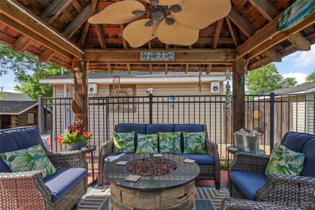 1732 N Little, Cushing, OK 74023 - view of patio featuring a gazebo, an outdoor living space with a fire pit, and a ceiling fan