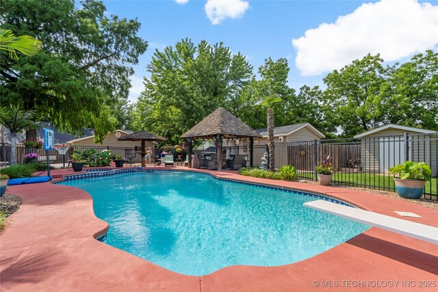 1732 N Little, Cushing, OK 74023 - view of swimming pool with a gazebo, a diving board, and a patio