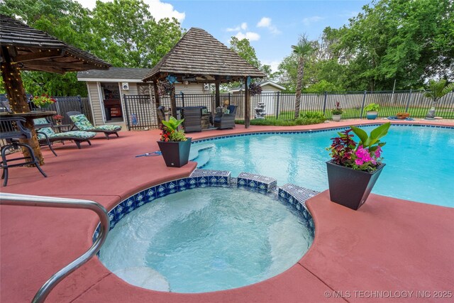 1732 N Little, Cushing, OK 74023 - view of pool with a gazebo and a pool with connected hot tub