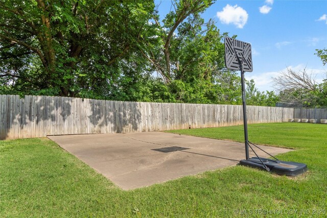 1732 N Little, Cushing, OK 74023 - view of basketball court with a fenced backyard and basketball court