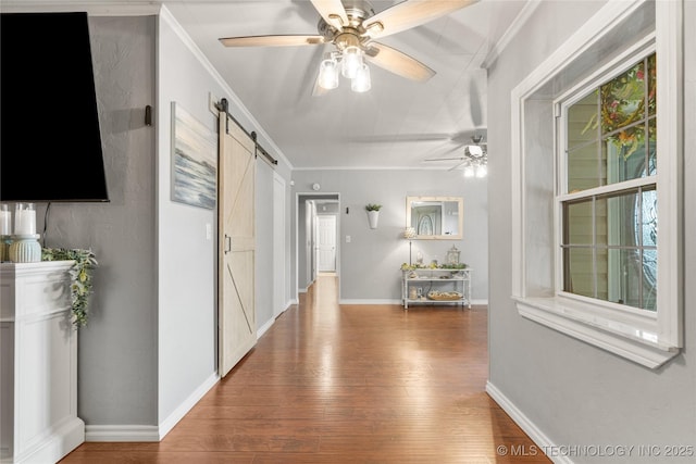 1732 N Little, Cushing, OK 74023 - hallway with a barn door, wood finished floors, and ornamental molding