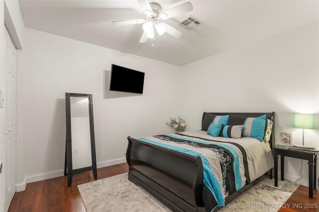 1732 N Little, Cushing, OK 74023 - bedroom featuring wood finished floors and a ceiling fan