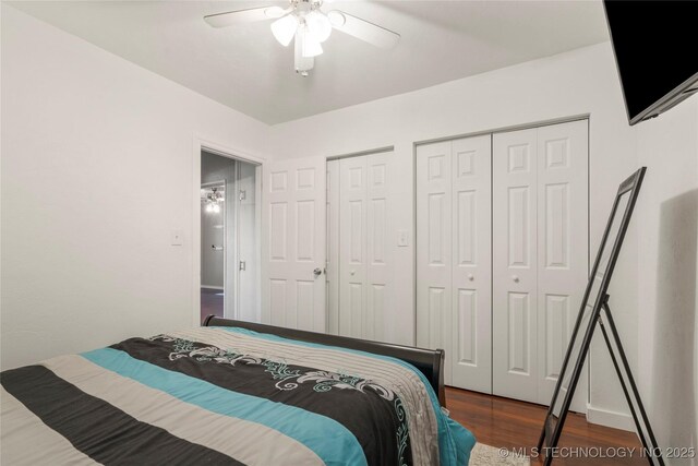 1732 N Little, Cushing, OK 74023 - bedroom with dark wood-type flooring, multiple closets, and ceiling fan