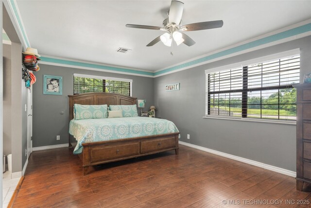 1732 N Little, Cushing, OK 74023 - bedroom featuring wood finished floors, ceiling fan, and crown molding