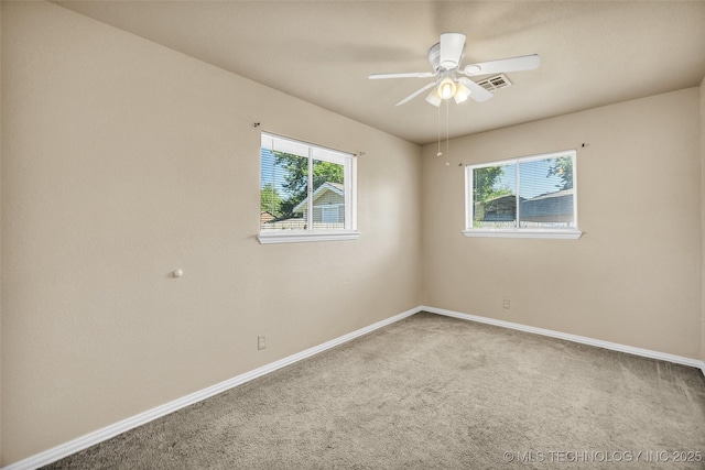 9429 E 36th St, Tulsa, OK 74145 - spare room with healthy amount of natural light, carpet floors, and baseboards