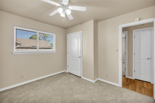 9429 E 36th St, Tulsa, OK 74145 - unfurnished bedroom with carpet floors, baseboards, and ceiling fan