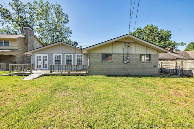 9429 E 36th St, Tulsa, OK 74145 - rear view of house with french doors, a wooden deck, and brick siding