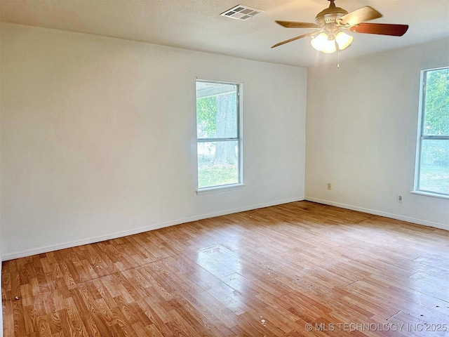 419 Minor St, Tahlequah, OK 74464 - empty room featuring plenty of natural light, light wood-type flooring, and baseboards