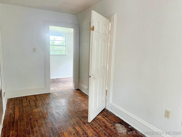419 Minor St, Tahlequah, OK 74464 - unfurnished room featuring dark wood-type flooring and baseboards