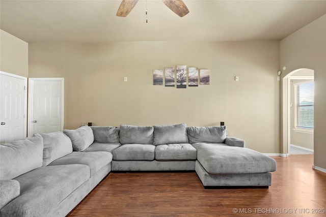 20225 E 44th St S, Broken Arrow, OK 74014 - living area with arched walkways, a ceiling fan, wood finished floors, and baseboards