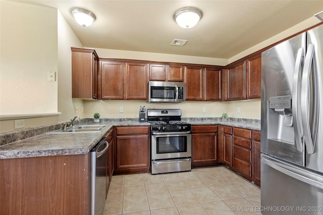 20225 E 44th St S, Broken Arrow, OK 74014 - kitchen featuring appliances with stainless steel finishes, a sink, and light tile patterned floors