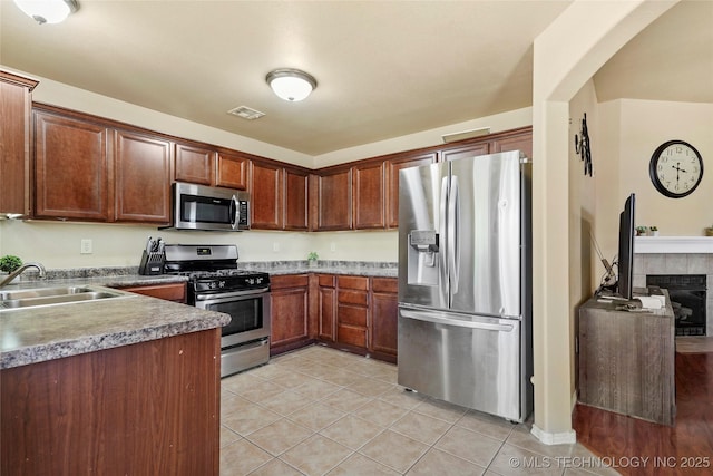 20225 E 44th St S, Broken Arrow, OK 74014 - kitchen with appliances with stainless steel finishes, a sink, and light tile patterned flooring
