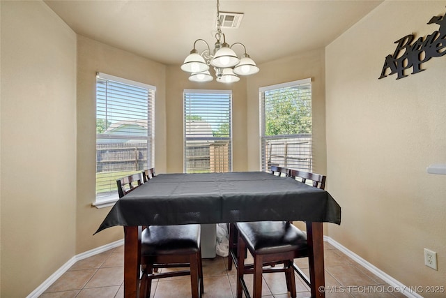 20225 E 44th St S, Broken Arrow, OK 74014 - dining area featuring a chandelier, baseboards, and light tile patterned floors