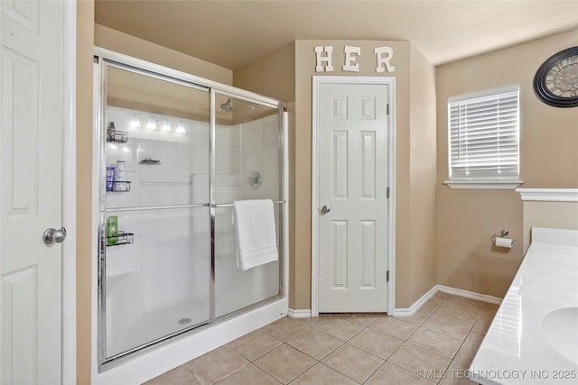 20225 E 44th St S, Broken Arrow, OK 74014 - full bathroom with tile patterned floors, a shower stall, baseboards, and double vanity