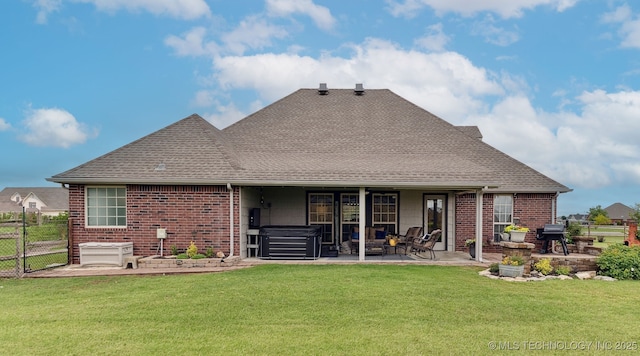 5720 E 144th St N, Collinsville, OK 74021 - rear view of property featuring a hot tub, a patio area, brick siding, a shingled roof, and a gate