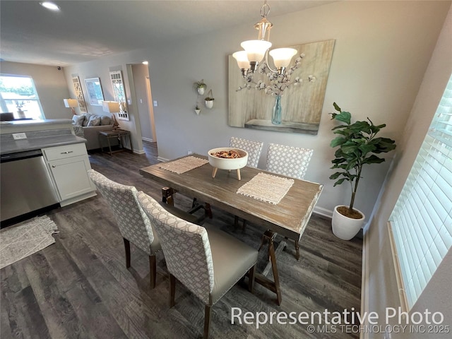 8400 E Princeton St, Broken Arrow, OK 74014 - dining room with dark wood-type flooring, a chandelier, and baseboards