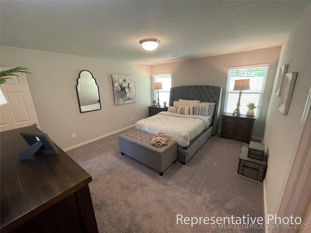 8400 E Princeton St, Broken Arrow, OK 74014 - bedroom with multiple windows, carpet, a textured ceiling, and baseboards