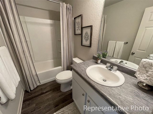 8400 E Princeton St, Broken Arrow, OK 74014 - full bathroom featuring wood finished floors, vanity, shower / bath combination with curtain, toilet, and a textured wall
