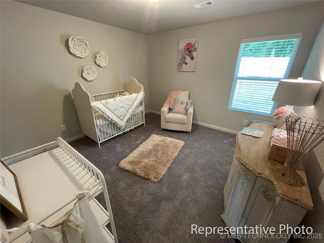 8400 E Princeton St, Broken Arrow, OK 74014 - carpeted bedroom with a crib and baseboards