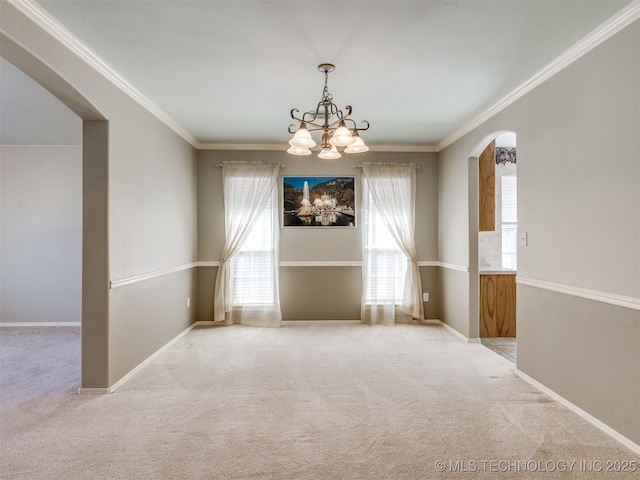 4708 W Indianola St, Broken Arrow, OK 74012 - empty room featuring arched walkways, light colored carpet, a chandelier, crown molding, and baseboards