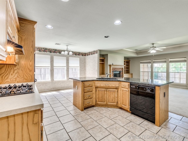 4708 W Indianola St, Broken Arrow, OK 74012 - kitchen with black dishwasher, a sink, gas stovetop, open floor plan, and a fireplace