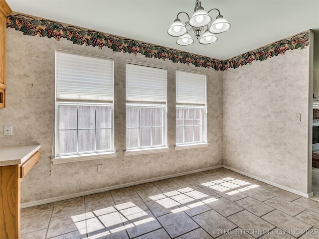 4708 W Indianola St, Broken Arrow, OK 74012 - unfurnished dining area with a chandelier and baseboards