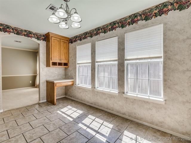 4708 W Indianola St, Broken Arrow, OK 74012 - unfurnished dining area with baseboards, a chandelier, crown molding, arched walkways, and light tile patterned flooring