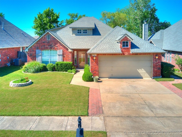 4708 W Indianola St, Broken Arrow, OK 74012 - traditional-style home featuring brick siding, a shingled roof, a garage, and a front lawn