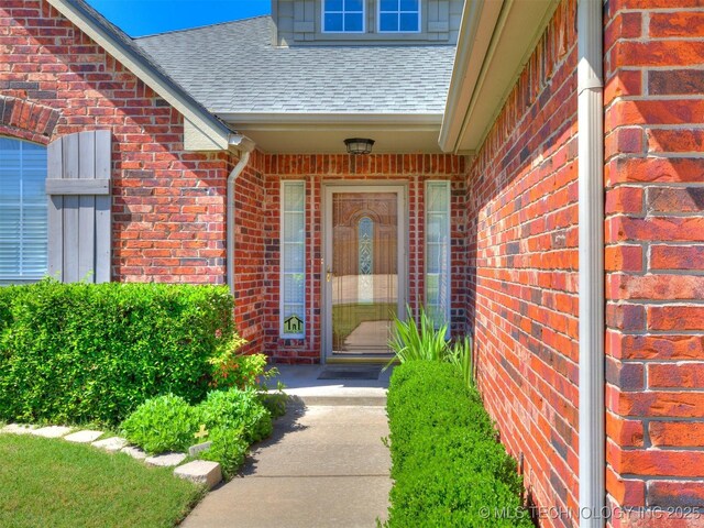 4708 W Indianola St, Broken Arrow, OK 74012 - property entrance featuring brick siding and a shingled roof