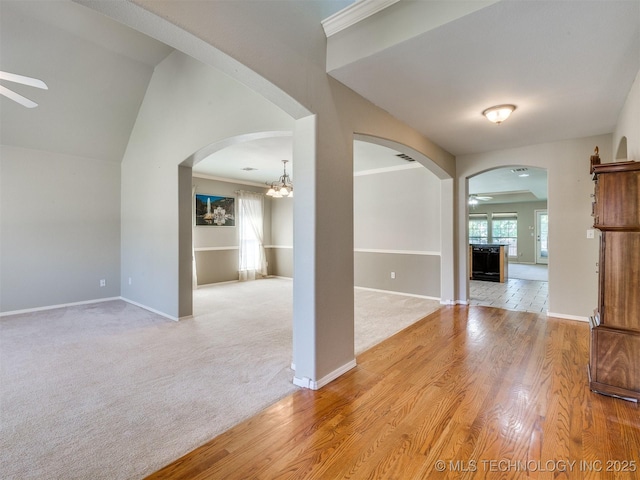 4708 W Indianola St, Broken Arrow, OK 74012 - spare room with ceiling fan, arched walkways, light wood-type flooring, and baseboards