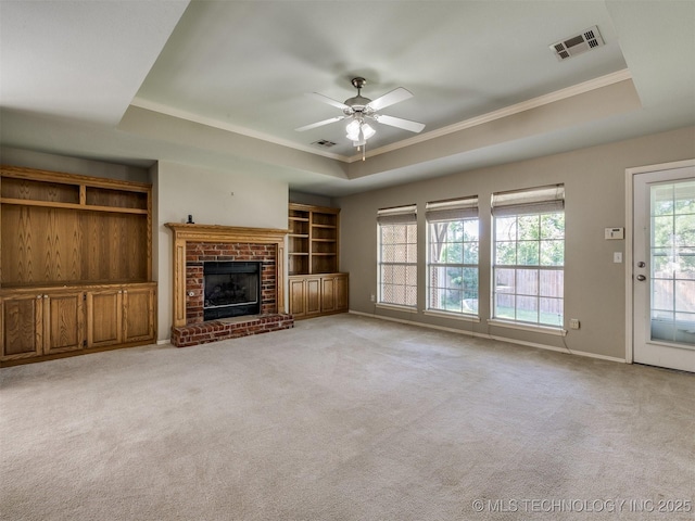 4708 W Indianola St, Broken Arrow, OK 74012 - unfurnished living room featuring a tray ceiling, ceiling fan, crown molding, and light colored carpet