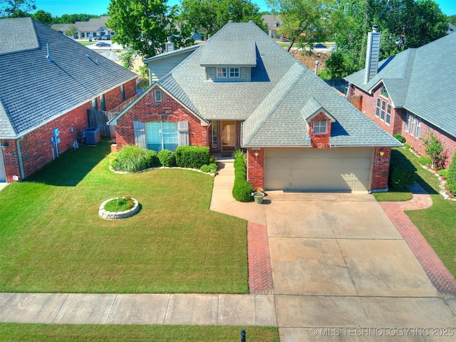 4708 W Indianola St, Broken Arrow, OK 74012 - traditional-style home featuring brick siding, a shingled roof, concrete driveway, a garage, and a front lawn